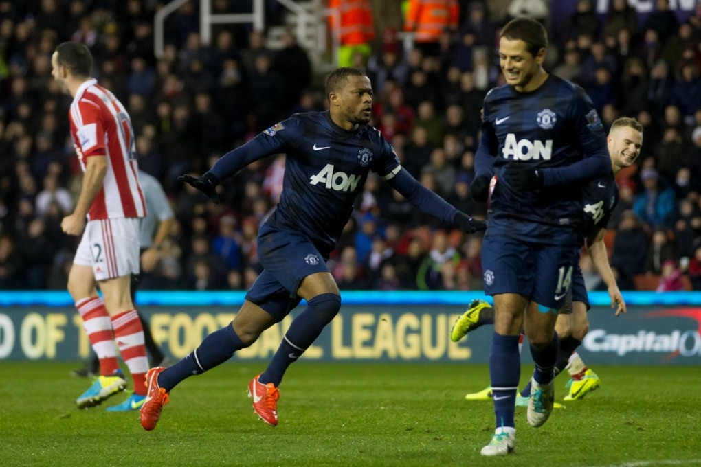 Patrice Evra celebrates after scoring for Manchester United against Stoke during their League Cup quarter-final at the Britannia Stadium. Photo: AP