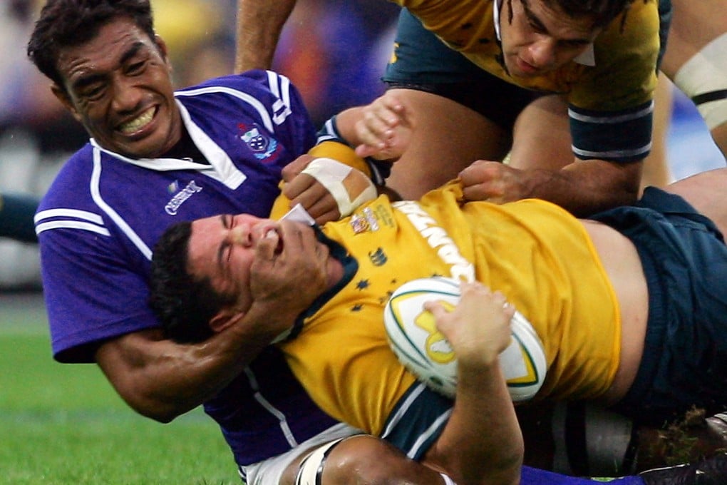 Samoa's Brian Lima gets to grips with Australia's Jeremy Paul in a test match in Sydney in 2005. Photo: Reuters