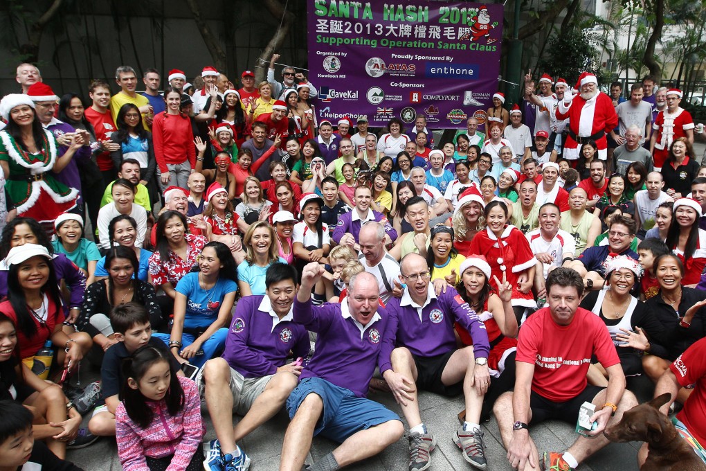 Hash runners are keen to get going as they gather before the start of the Operation Santa Claus Santa Hash 2013 at Lockhart Road playground in Wan Chai. Photo: Jonathan Wong