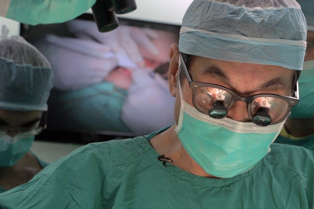 One of the surgical team involved in the 10-hour operation focuses on Yik Siu-ling earlier this week. Photo: SCMP