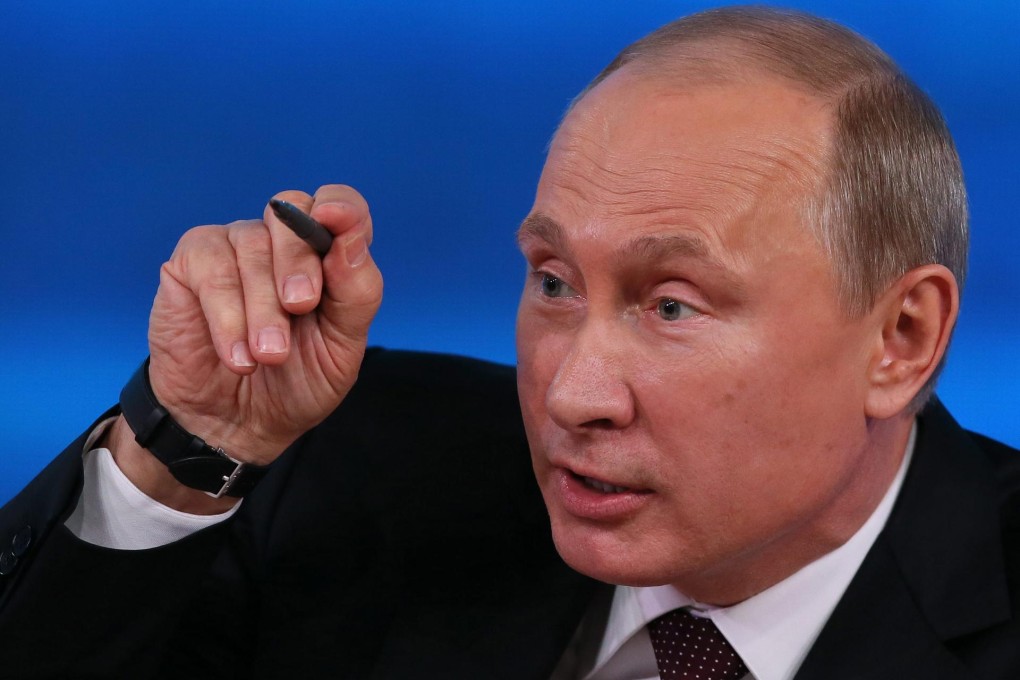 Putin makes a point at his annual press conference. Photo: EPA