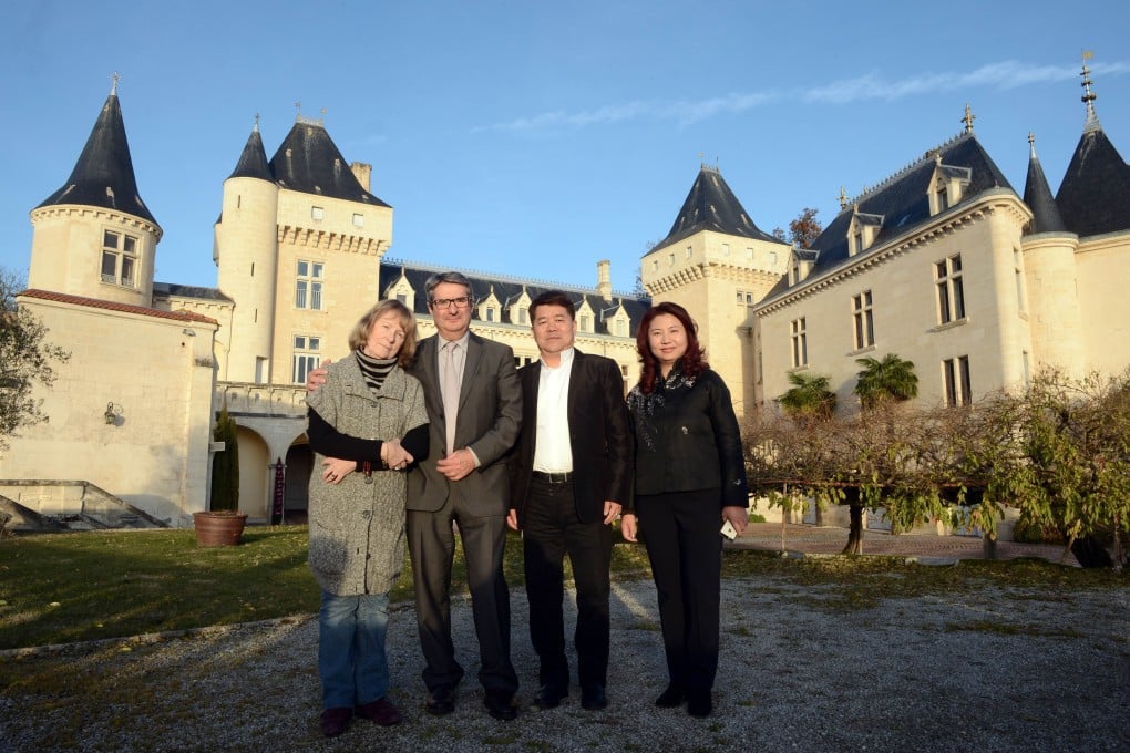 Kok Lam and wife Lau Sheng-wan pose with former owner James Gregoire and his wife just hours before the crash. Photo: AFP
