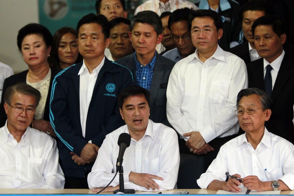 Abhisit Vejjajiva (centre) announces the poll boycott. Photo: Reuters