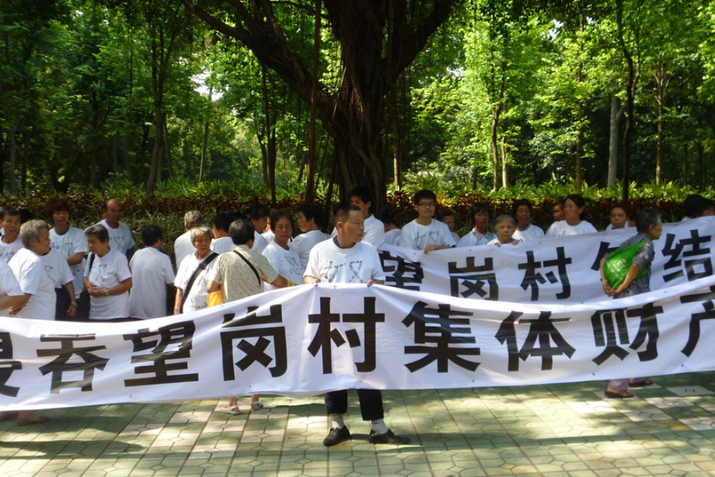 Residents of Wanggang accused their village party chief of pocketing millions from leasing collective land in August 2011. Guangzhou's anti-graft agency says about a quarter of its cases involved village chiefs. Photo: Mimi Lau