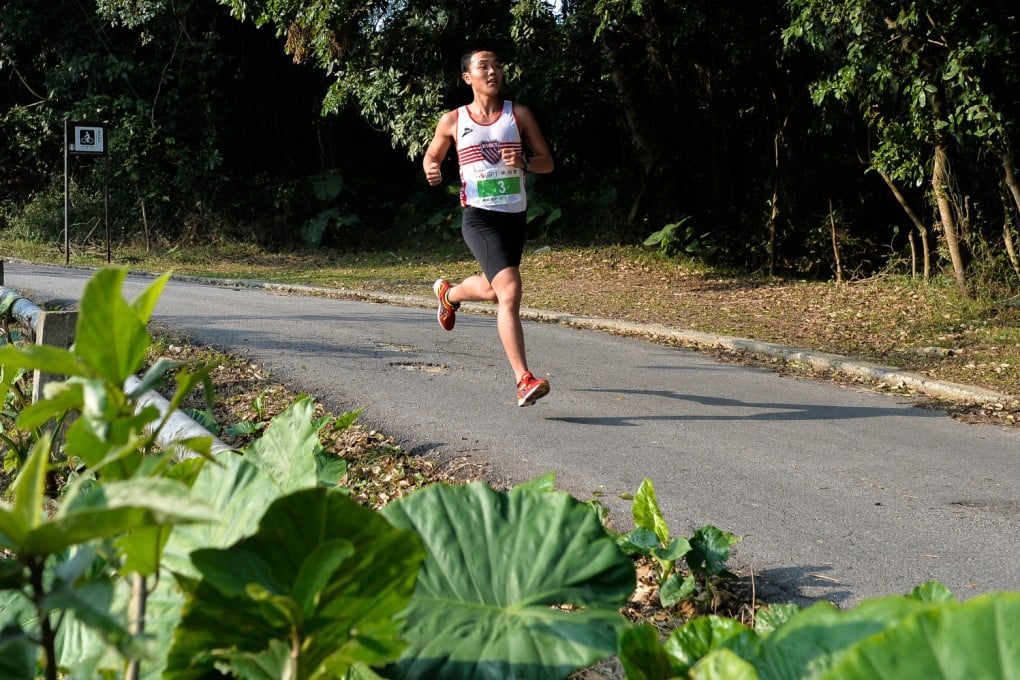 Alvin Tang at the six-kilometre mark near Ho Pui Village en route to winning the SPT 30km race at Shek Kong yesterday. Photo: Richard Castka
