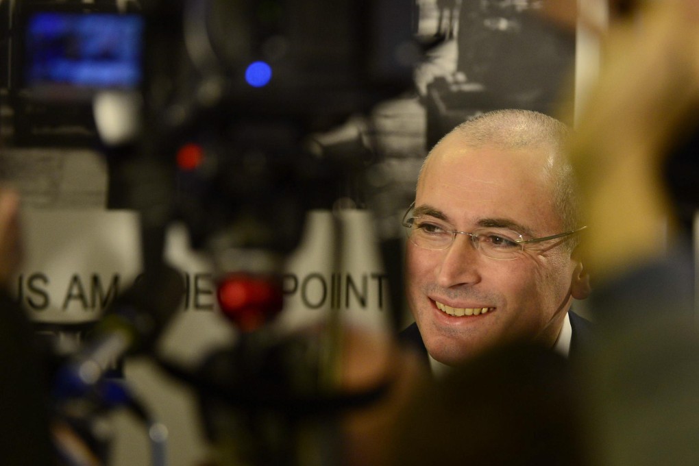 Mikhail Khodorkovsky arrives for his first news conference in Berlin following his release from prison in Russia. Photo: AFP