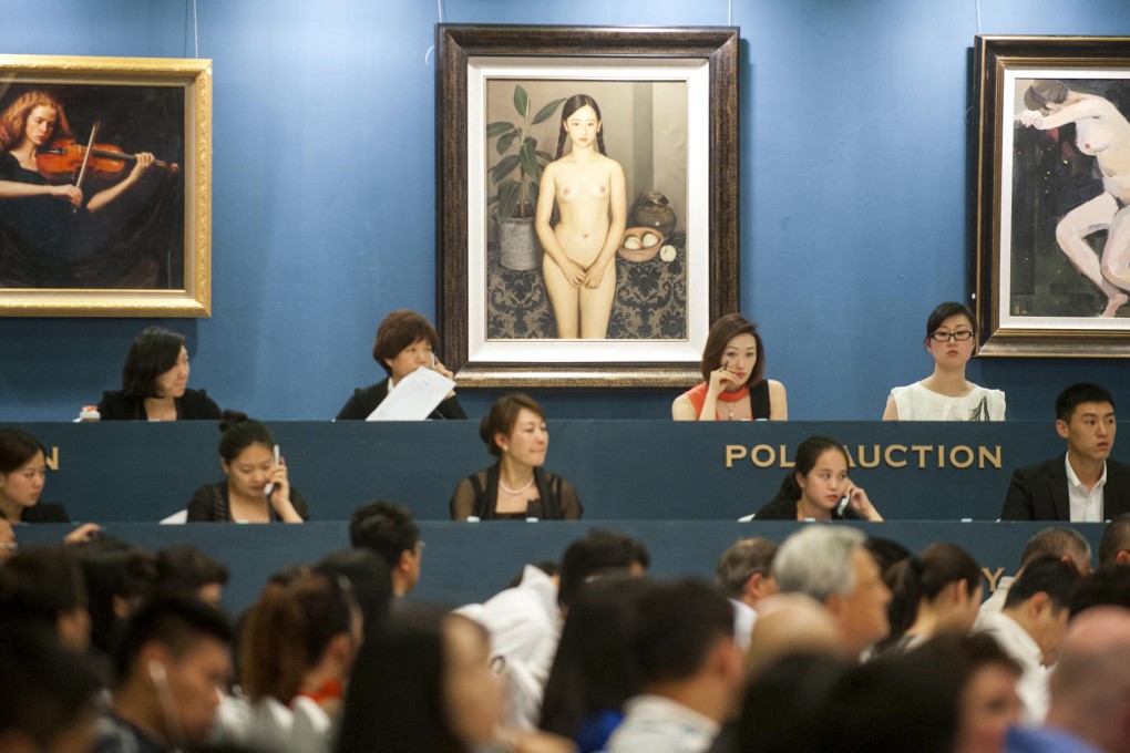 Bidding at the Poly 2012 Spring Art Auction in Beijing. Beijing Poly International Auction is the third-biggest auction house in the world, after Christie's and Sotheby's. Photo: AFP