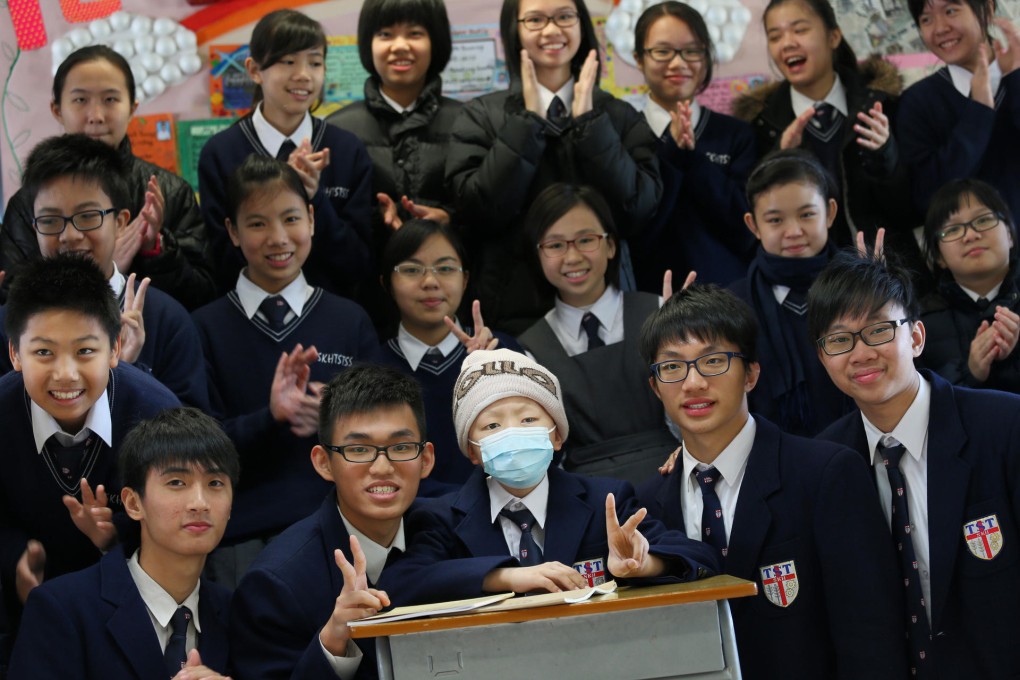 Cancer patient James Lin is surrounded by his new friends at S.K.H. Tsang Shiu Tim Secondary School. Photo: K.Y. Cheng