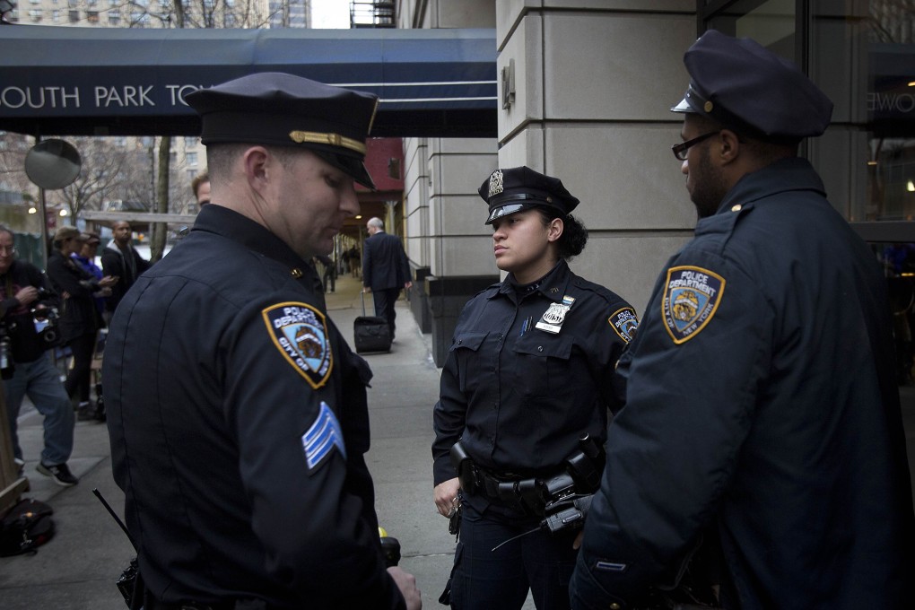 Police respond to South Park Tower, the 54-storey high-rise in Manhattan. Photo: Reuters