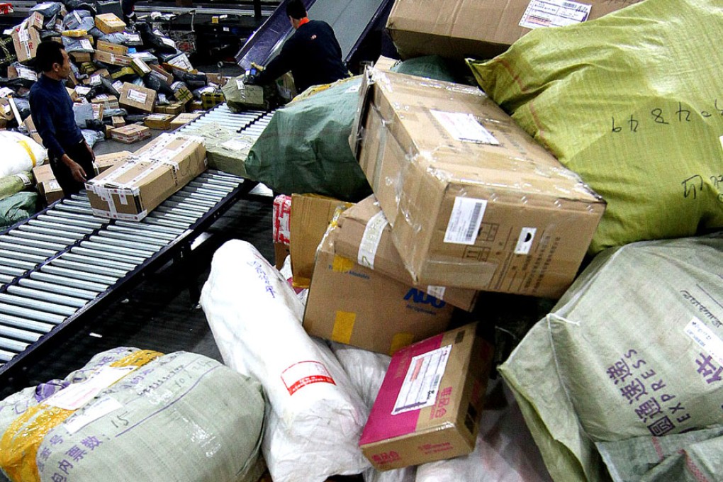 Packages pile up at YTO Express' sorting centre. A parcel transported by the company's truck has leaked toxic chemical.