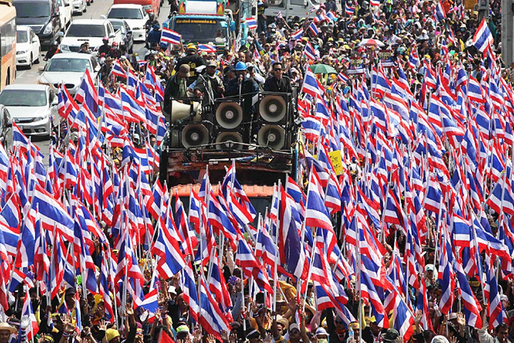 Thai anti-government protesters abandoned efforts to block candidates from signing up for a February election on Tuesday. Photo: Reuters