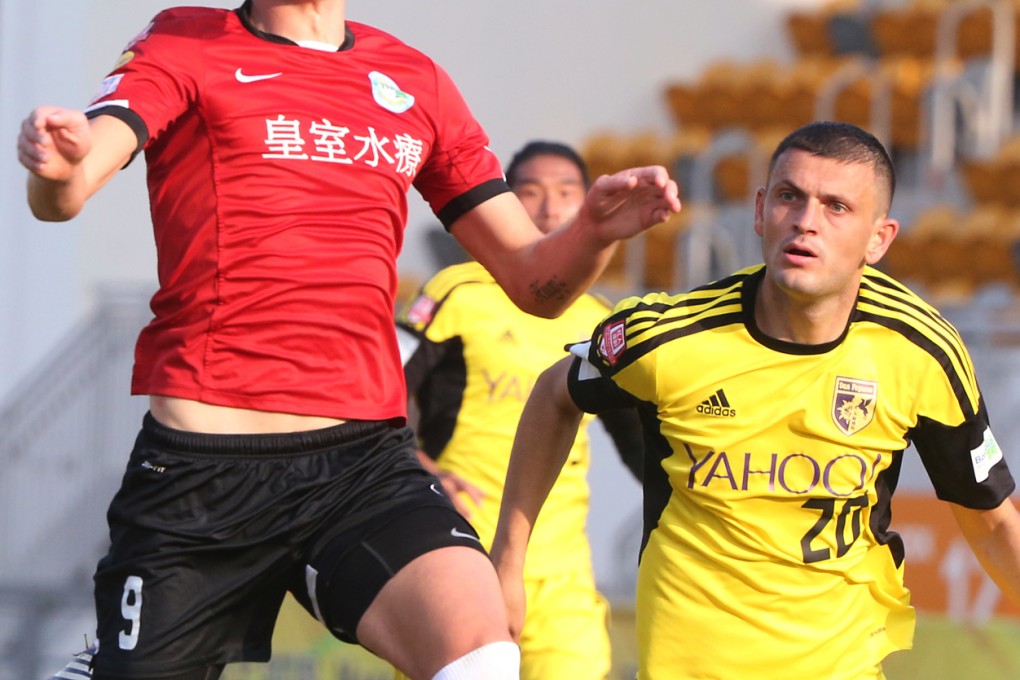 Royal Southern’s Jonathan Carril tries to control the ball as Sun Pegasus’ Igor Miovic challenges in their Canbo Senior Shield semi-final match at Mong Kok Stadium on Thursday. Photo: David Wong