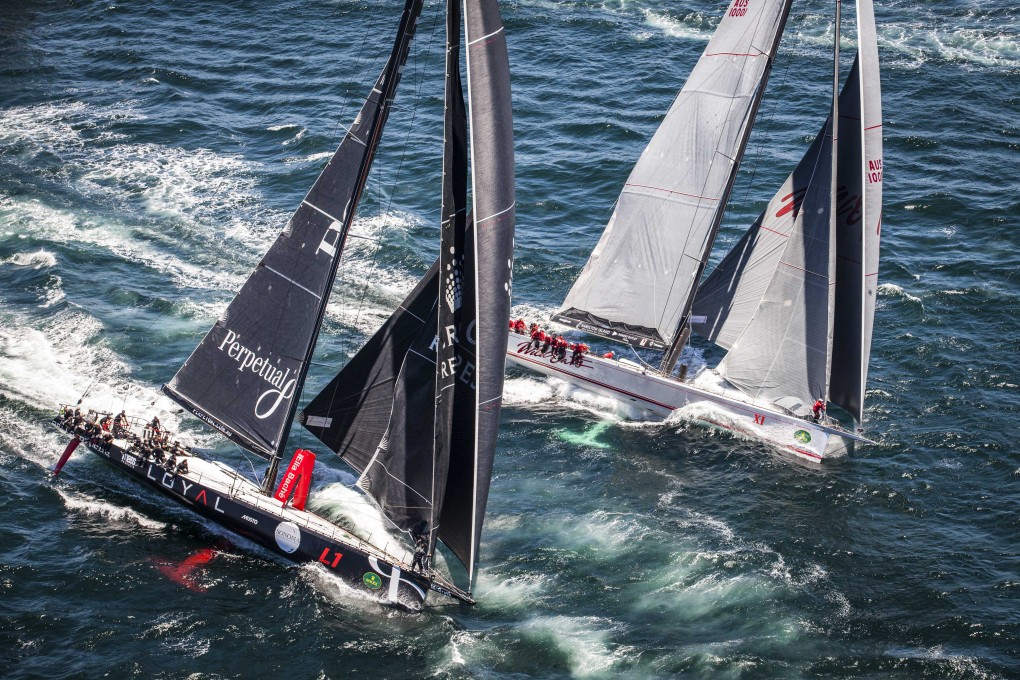 Perpetual Loyal (left) and Wild Oats Xl duel during the start of the Sydney to Hobart yacht race in Sydney on Thursday. Photo: AP