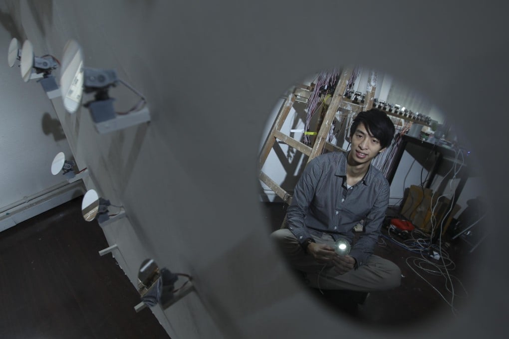 Kenny Wong at work in his studio in Wan Chai. Photo: Nora Tam