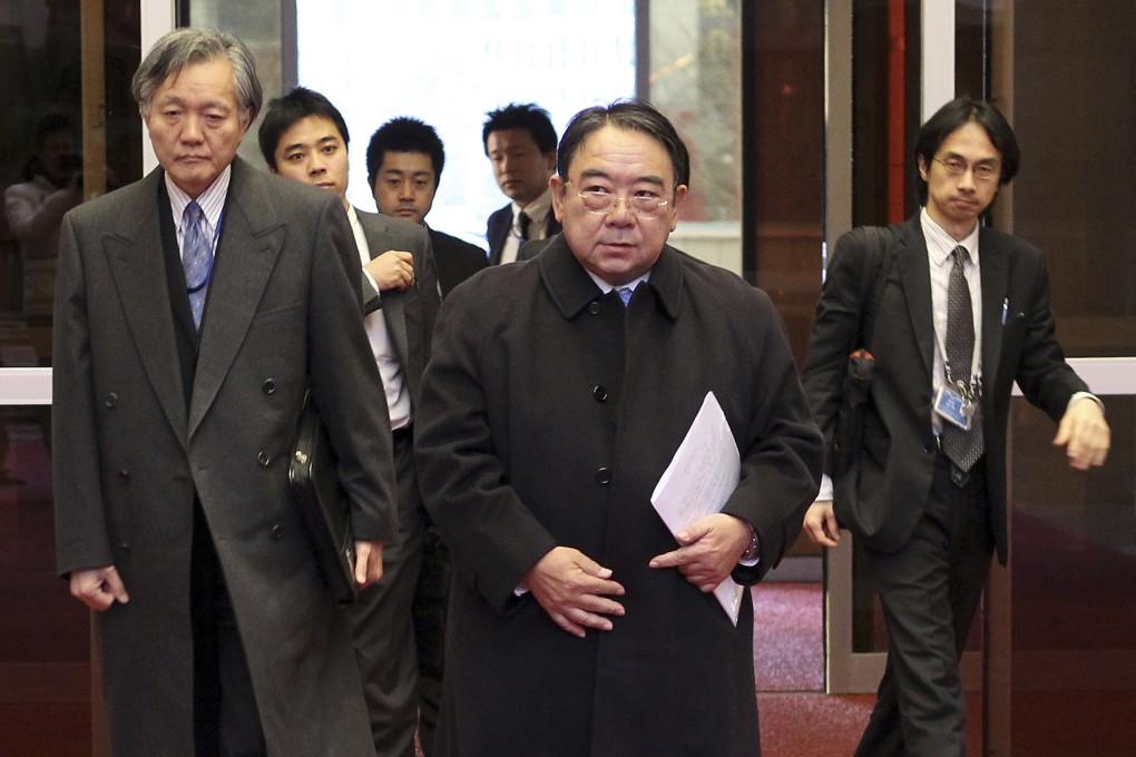 Japan's ambassador to China Masato Kitera (centre) in Beijing after being summoned by China's Foreign Minister Wang Yi. Photo: Reuters