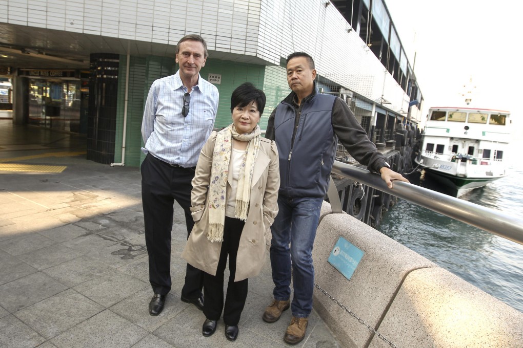 Amy Yung stands with Discovery Bay residents Edwin Rainbow (left) and Les Chu at the ferry pier in Central. Photo: Jonathan Wong