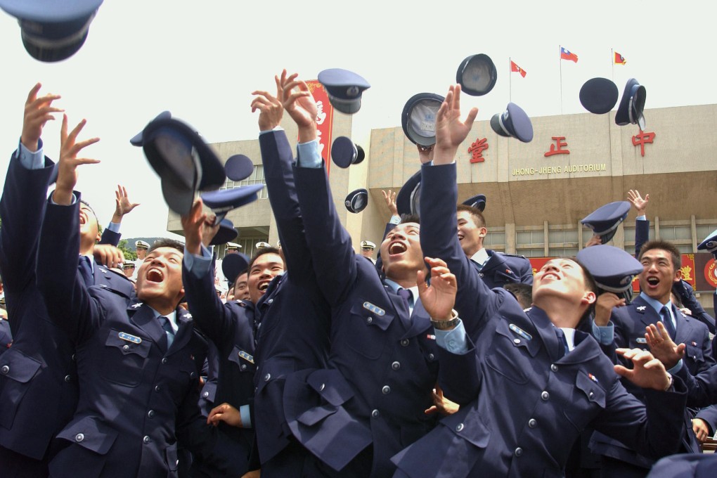 Cadets celebrate during a joint graduation ceremony of five military academies in Taipei. Photo: AFP