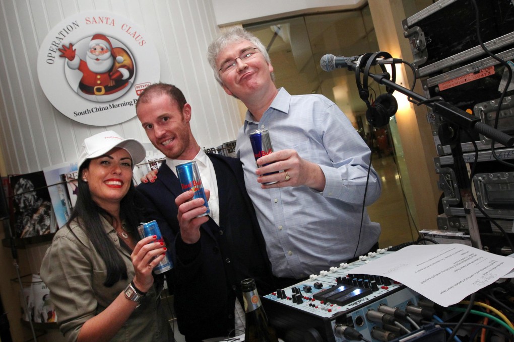 RTHK radio presenters Chantel Shafie and Tim Littlechild (centre) celebrate their feat with senior producer Steve James. Photo: Nora Tam