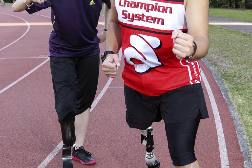 Runners Lucia Lai (left) and Davis Dai at Tsing Yi Sports Ground. Photo: Edmond So