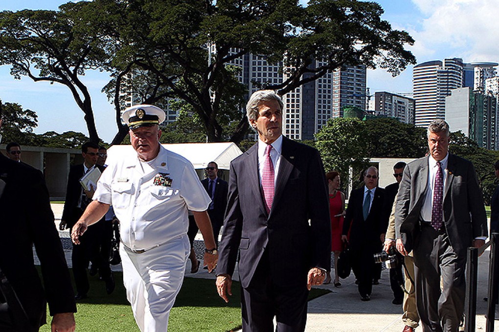 US Secretary of State John Kerry arrives for a wreath-laying ceremony at the Manila American Cemetery and Memorial in Manila. Photo: AFP