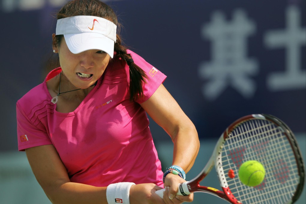 Zhang Ling hits a backhand return in her match against Mayo Hibi at Victoria Park on Tuesday. Photo: Sam Tsang