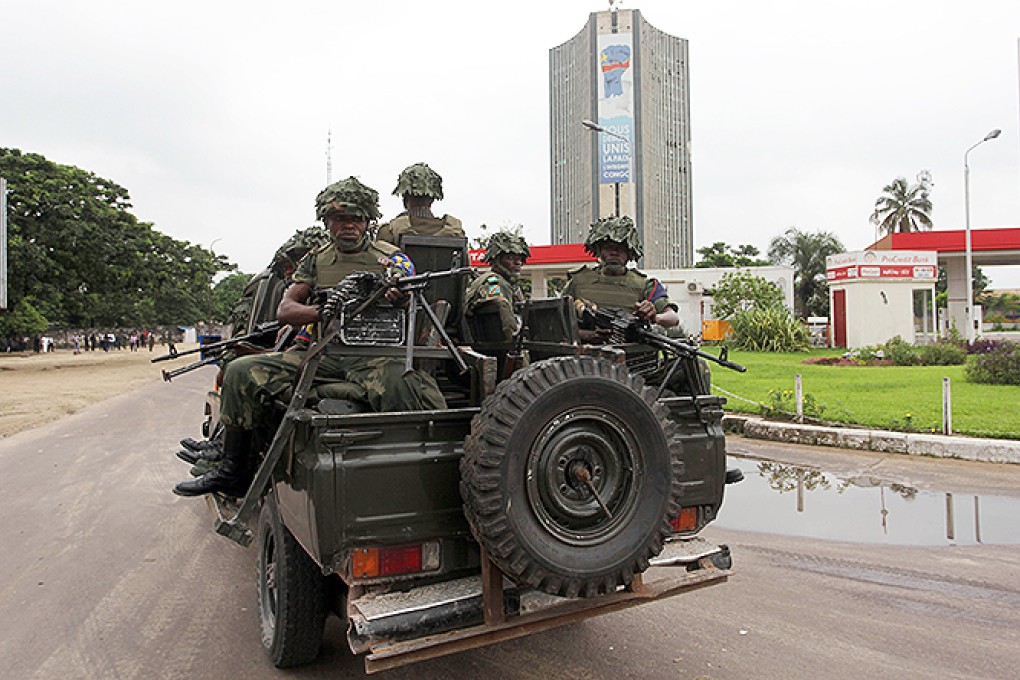 Soldiers of the Democratic Republic of Congo Army) on patrol near the headquarters of state broadcaster RTNC. Photo: AFP