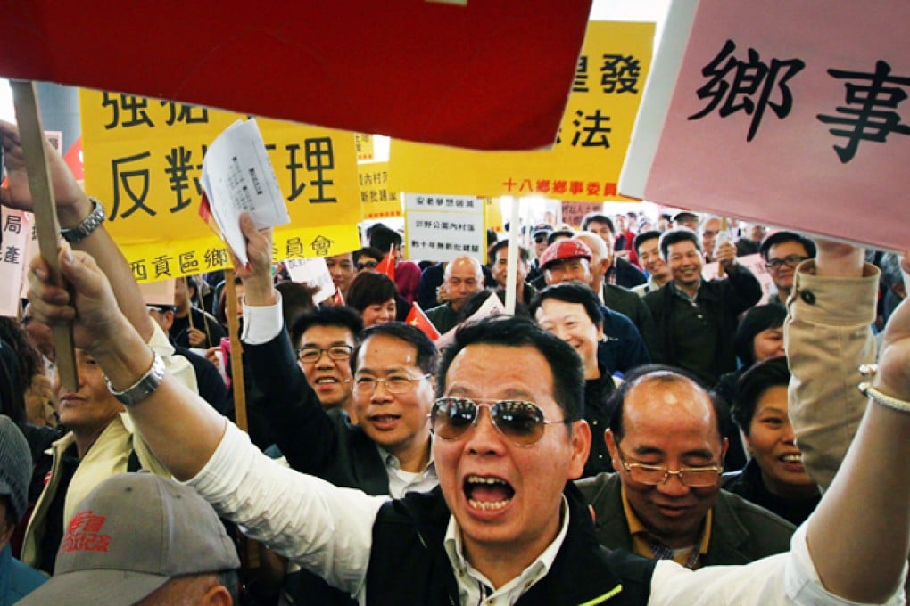 New Territories villagers stage a protest outside Legislative Council in Tamar to oppose the government's plan of including Tai Long Sai Wan in country park. Photo: Felix Wong