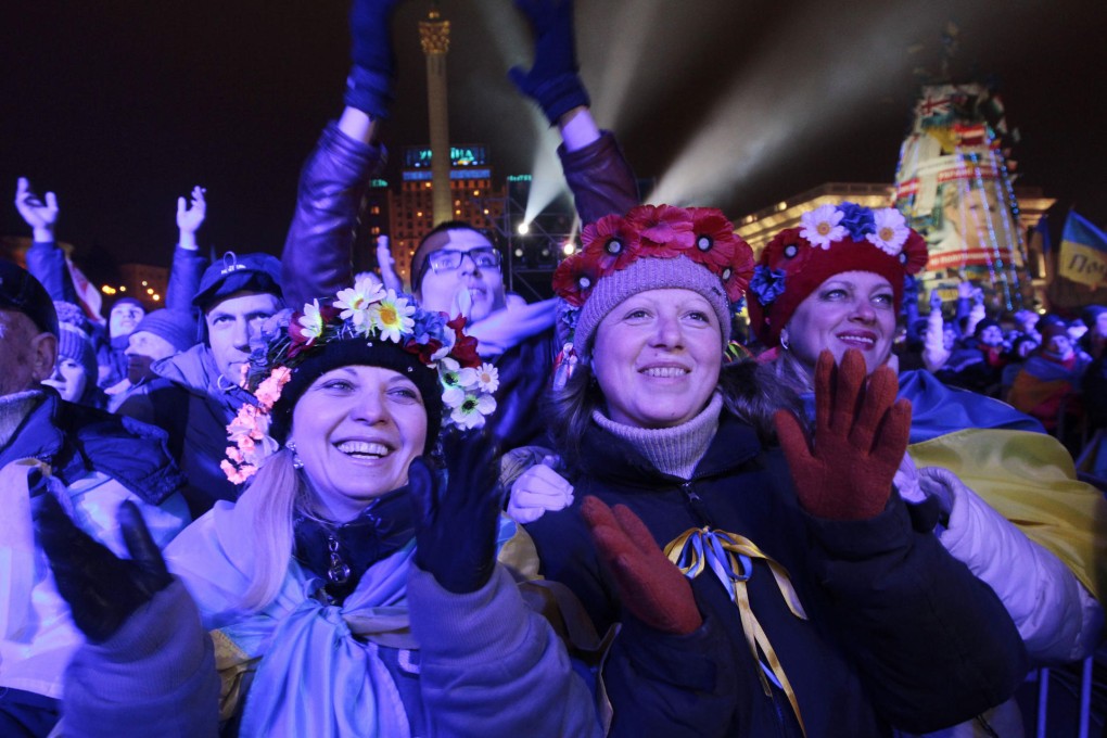 Pro-European Union activists celebrate in Kiev. Photo: AP