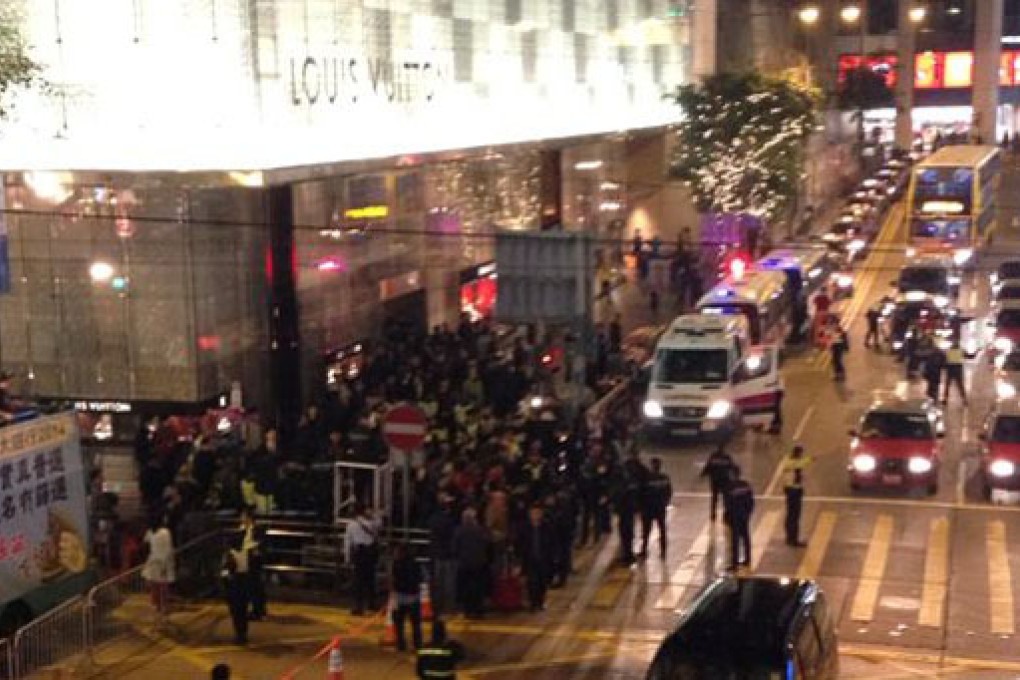 A group of protesters scuffle with police when trying to break a cordon line and block traffic on Pedder Street in Central. Photo: Jennifer Ngo