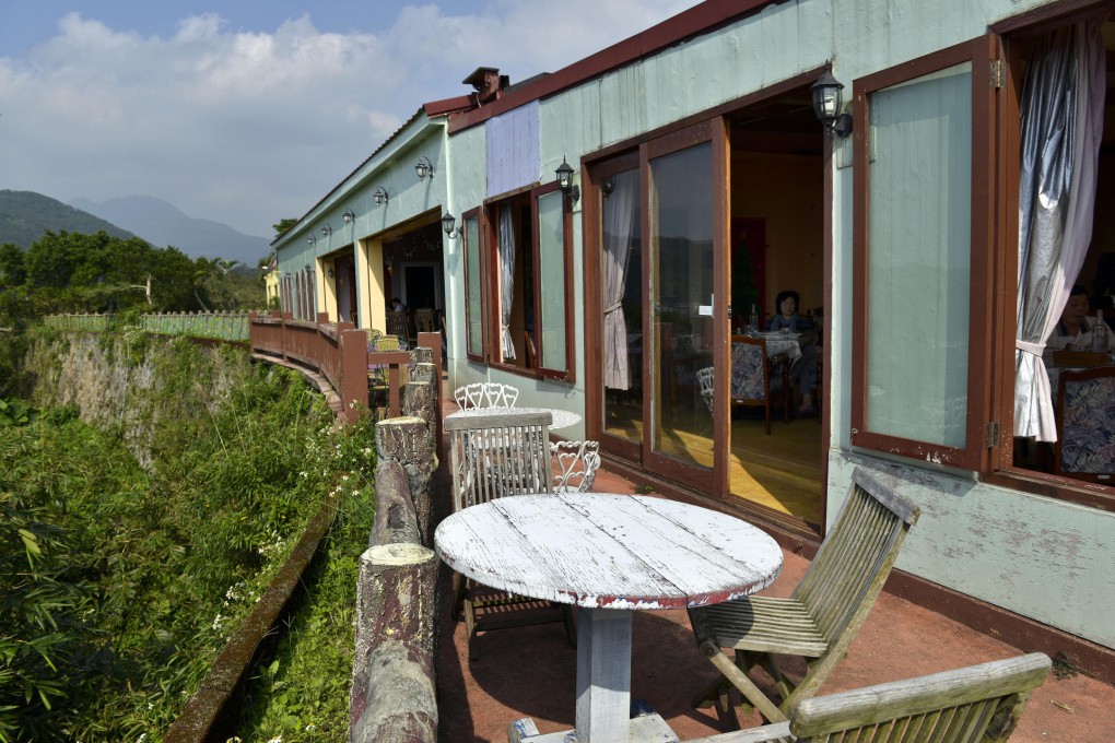 Weather-beaten tables and chairs on the verandah outside Faguo Nongzhuang restaurant. Photo: Chris Stowers