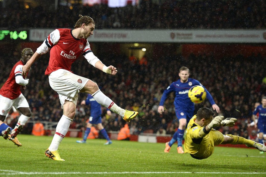 Arsenal's Nicklas Bendtner scores past Cardiff keeper David Marshall during their Premier League match at the Emirates. Photo: Reuters
