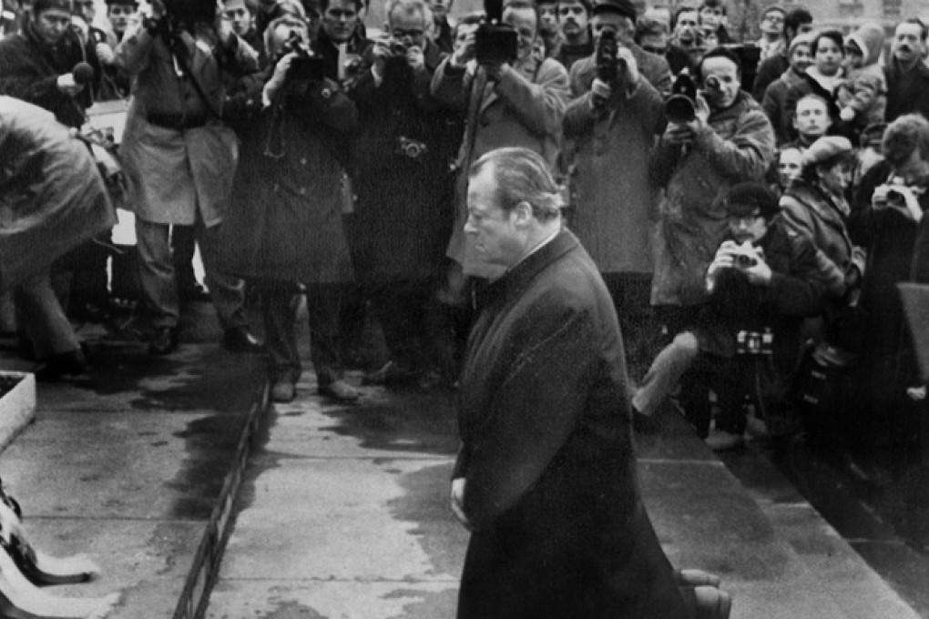 Brandt falls to his knees at a Polish monument to wartime victims. Photo: SCMP