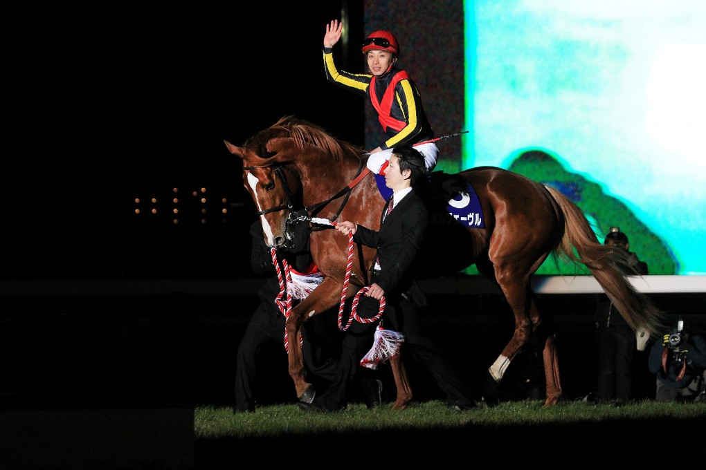 Smashing Arima Kinen winner Orfevre is presented to the crowd after his final run. Photo: JRA