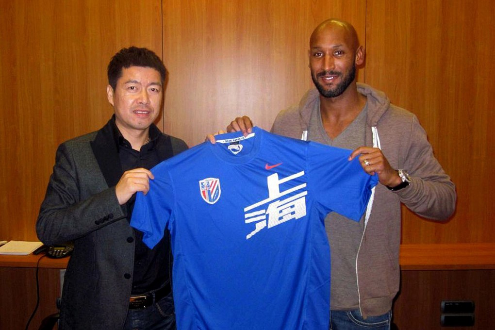 Zhu Jun with Nicolas Anelka in happier times. Photo: AFP