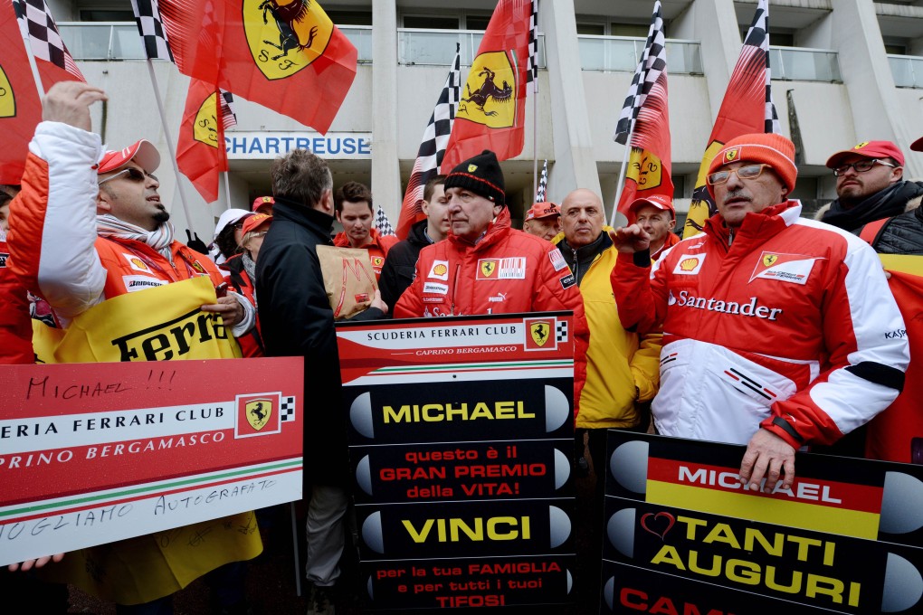 Michael Schumacher's fans gather outside Grenoble University Hospital Centre to mark his 45th birthday. Photo: AFP