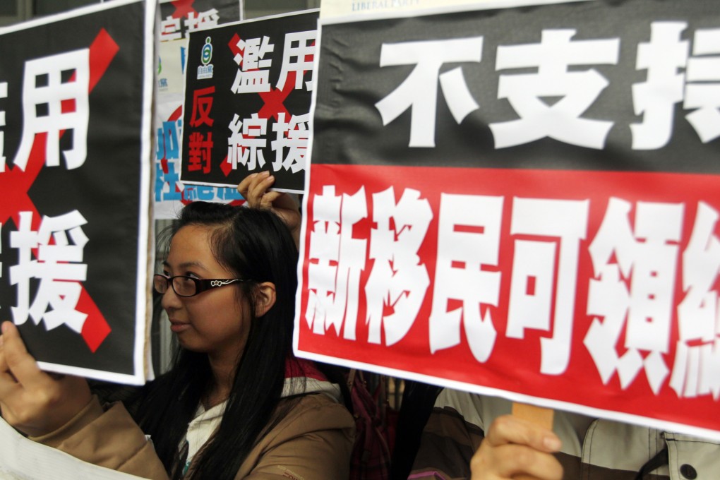 Members of Liberal Party stage a protest on December 17, 2013 after Court of Final Appeal ruled the government's policy of excluding new immigrants from its welfare programme is unconstitutional. Photo: SCMP/Sam Tsang