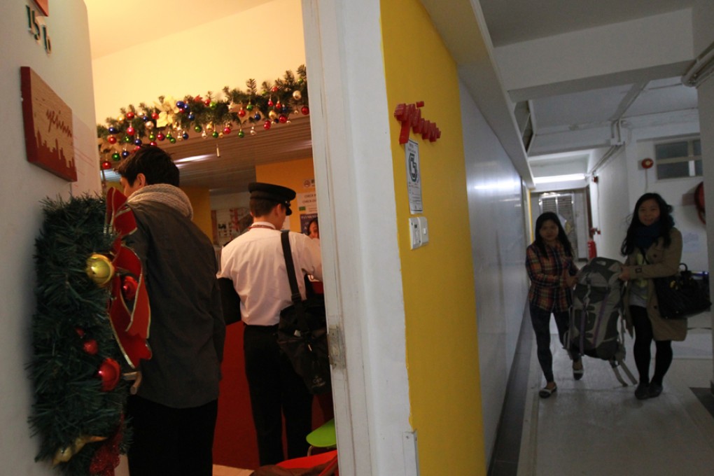 A guesthouse is inspected by a government official in Continental Mansion on King's Road in North Point.