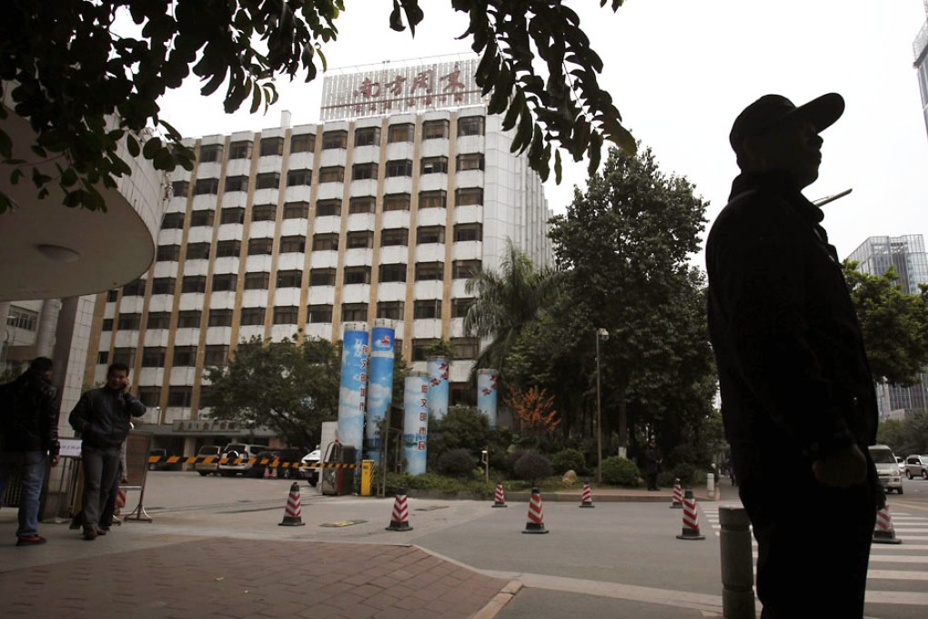 A policeman standing guard outside the office of Southern Weekly newspaper in Guangzhou. Photo: Reuters