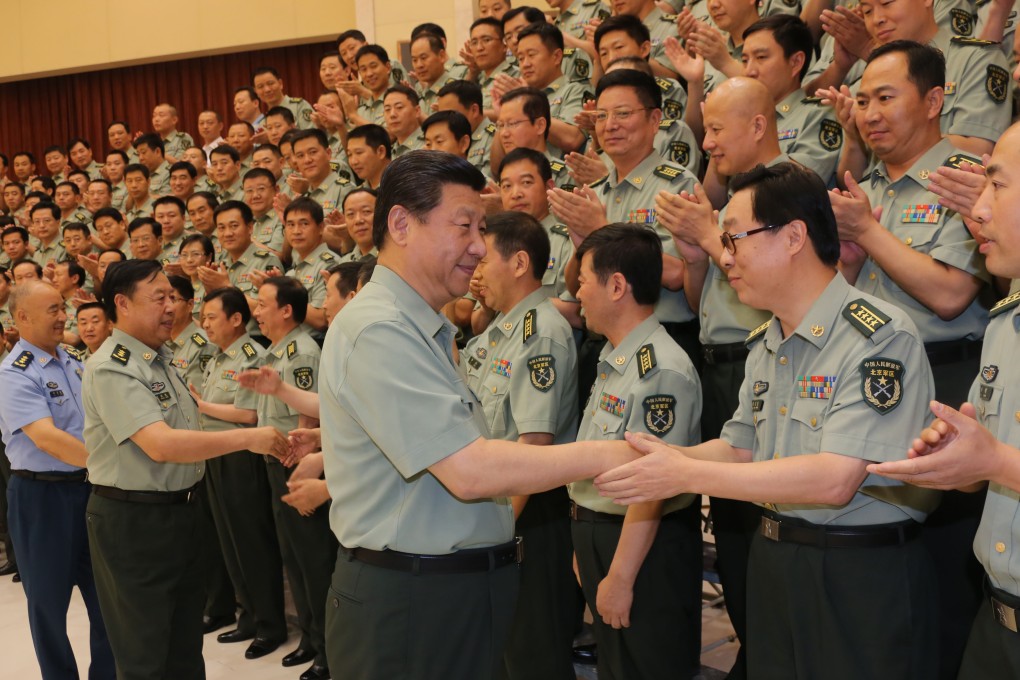 President Xi Jinping shakes hands with a military cadre during a tour of the Beijing Military Area Command. Photo: Xinhua