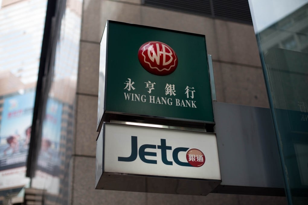 Shares in Wing Hang edged 0.17 per cent higher to close at HK$117.20 yesterday before reports of OCBC's bid. Photo: Bloomberg