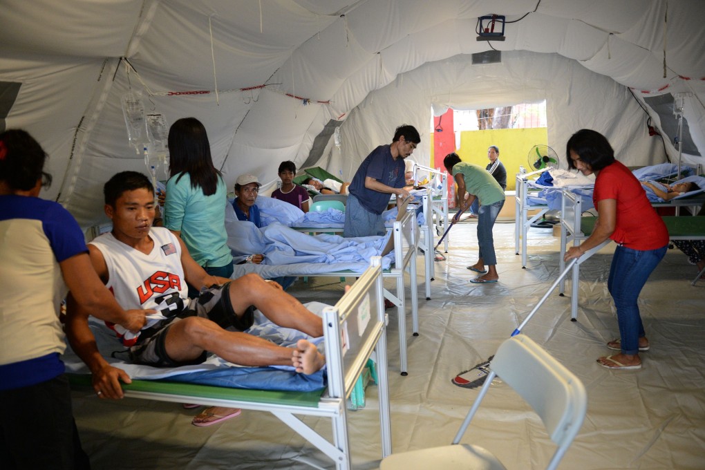 Patients inside one of the ward-tents of the Red Cross tent hospital in Basey town, central Philippines. Photo: AFP