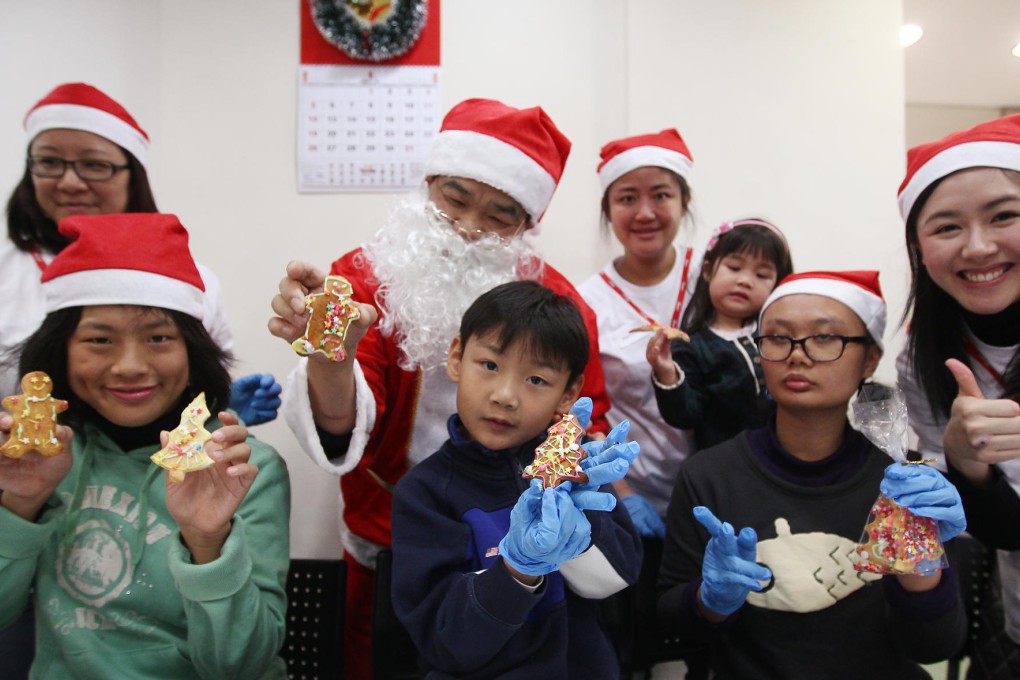 Volunteers from the Maxim Group and federation members show off the fruits of their surplus food workshop. Photo: Jonathan Wong