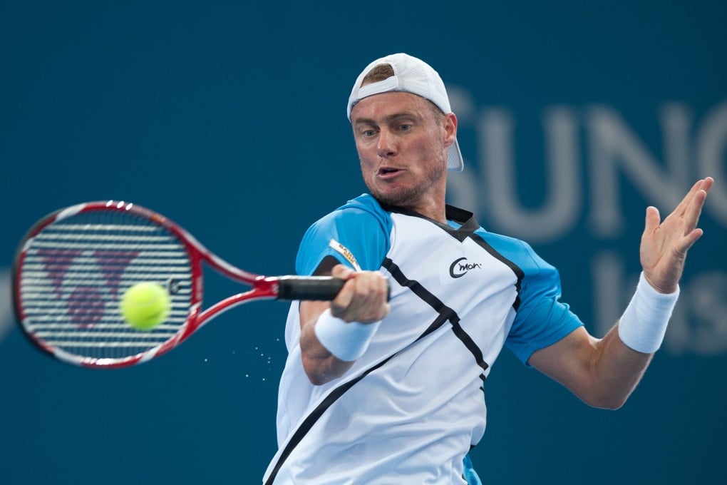 Lleyton Hewitt of Australia returns the ball during his men's singles final match against Roger Federer of Switzerland at the Brisbane International. Photo: Xinhua
