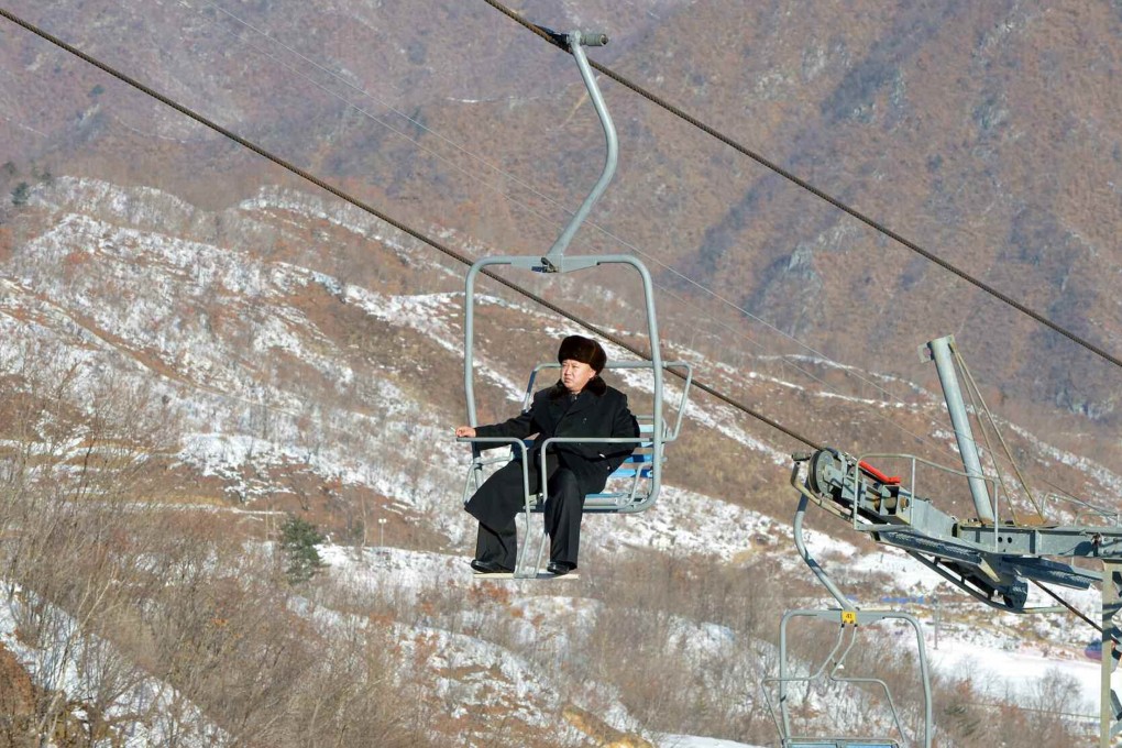 North Korean leader Kim Jong Un sits on a ski lift during a visit to a newly built ski resort in the Masik Pass region. Photo: Reuters