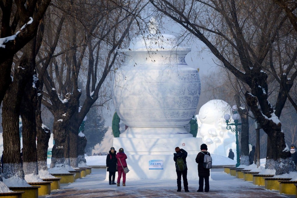 Visitors looking at a snow sculpture at the Sun Island International Snow Sculpture Art Expo, in Harbin, northeastern province of Heilongjiang. Photo: AFP