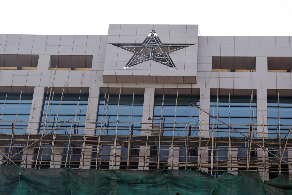 Hard to miss: the emblem was unveiled as workers put the finishing touches to a 20-month facelift of the barracks. Photo: David Wong