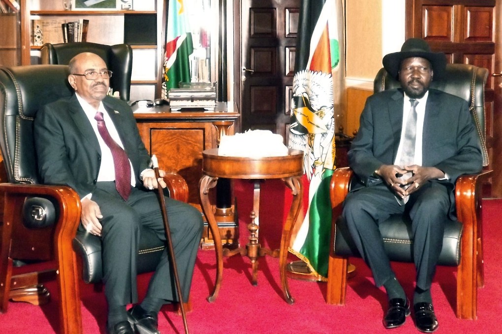 Sudan President Omar al-Bashir (left) and his South Sudan counterpart Salva Kiir pose before a meeting on Monday in Juba. Photo: AFP