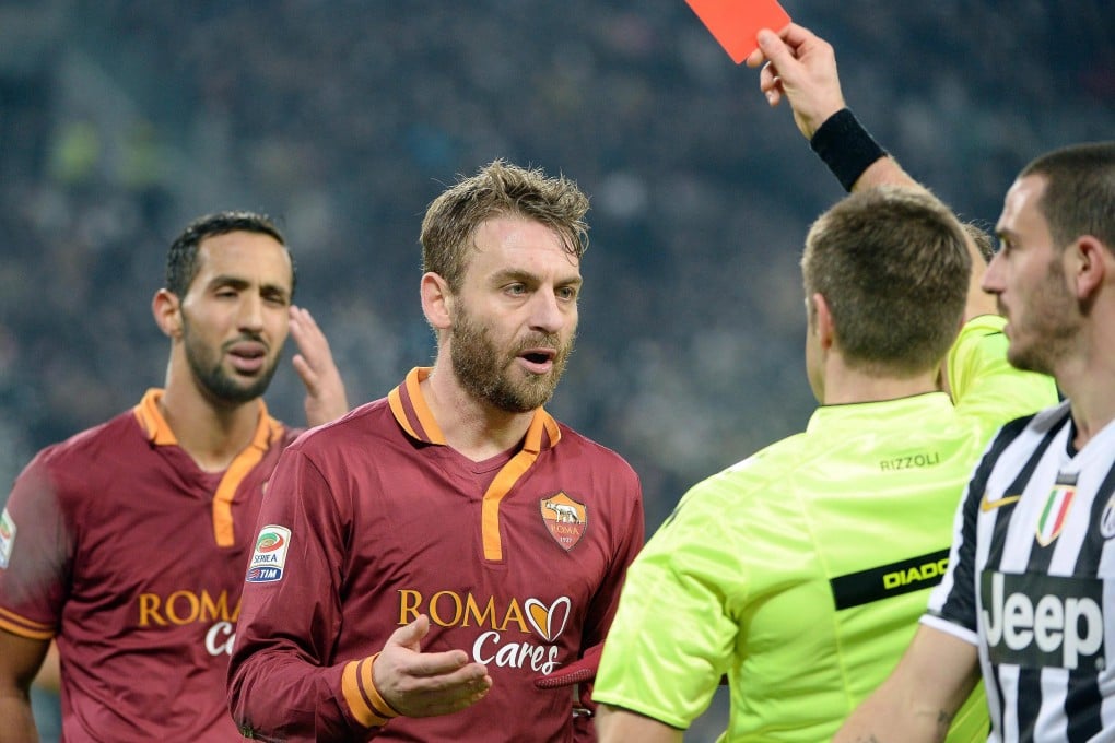 AS Roma midfielder Daniele De Rossi is sent off during an ill-tempered match against Juventus. Photo: EPA
