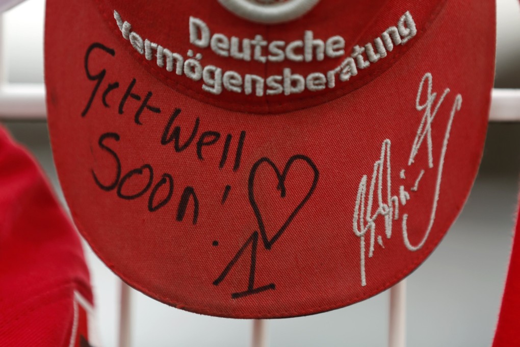 A cap marking the 45th birthday of seven-times former Formula One world champion Michael Schumacher is placed on a fence outside the German's cart racing track in the western city of Kerpen. Photo: Reuters