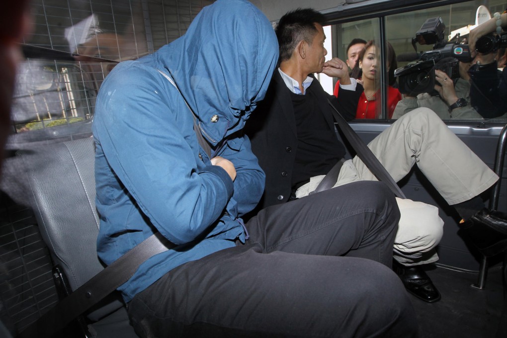 Happy Valley players are escorted in ICAC vehicles at the headquarters of the anti-graft agency in North Point yesterday. Photo: Sam Tsang